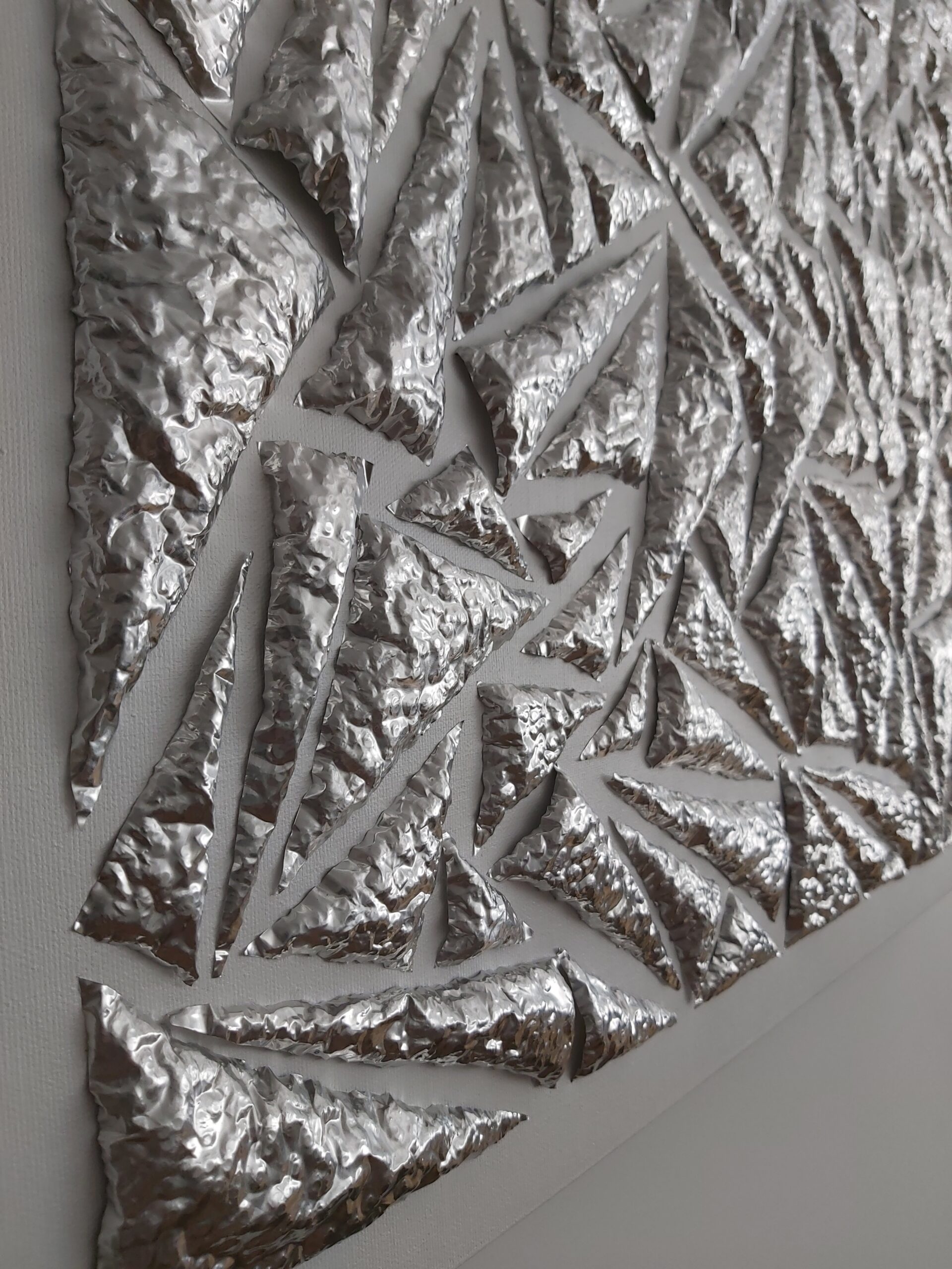 Close up of beaten aluminium pieces by Richard Noel artist