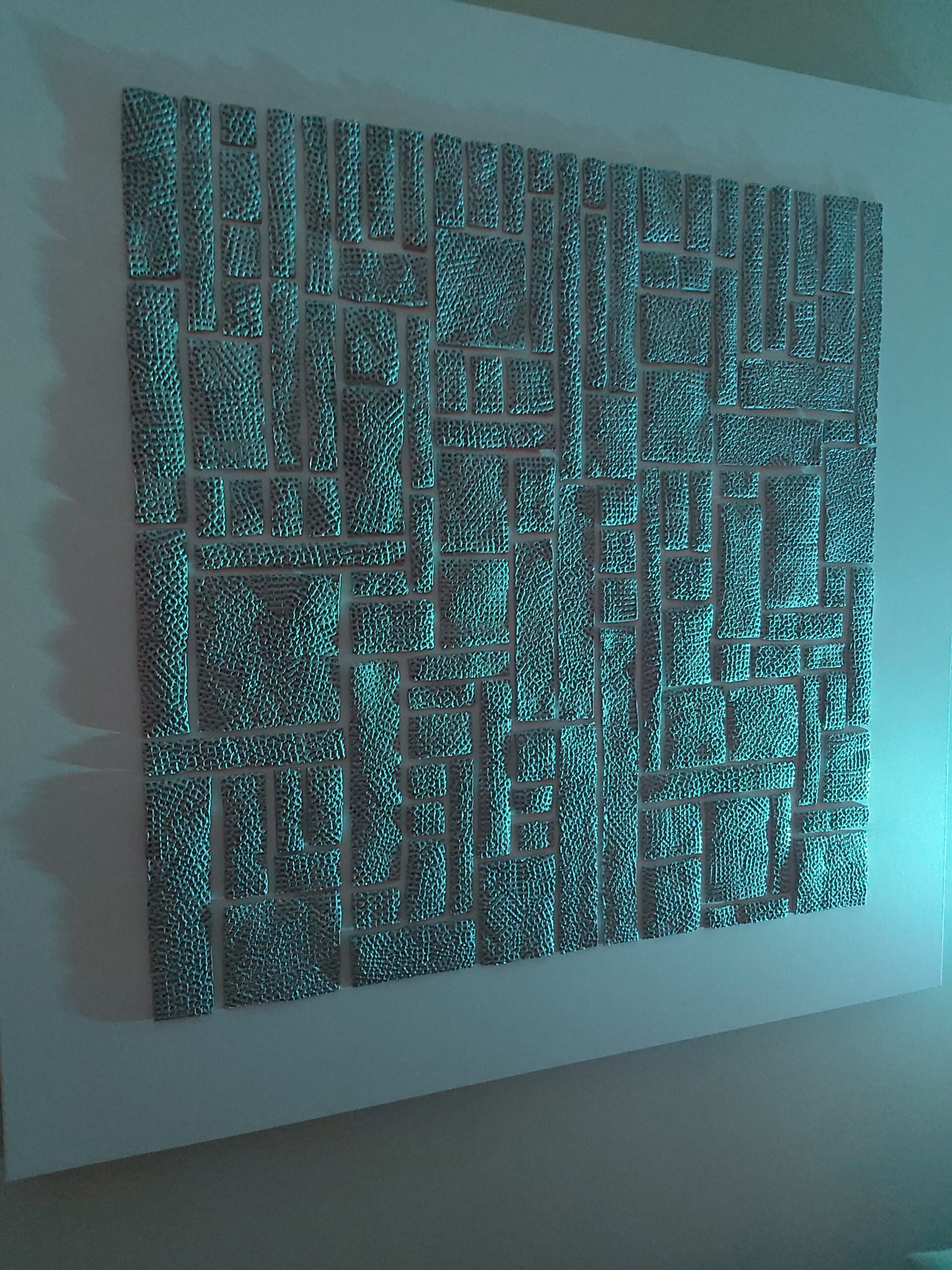Nightfall I art creation lit up in blue light by artist Richard Noel