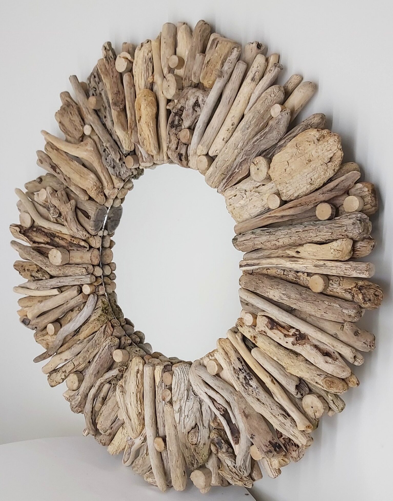 This driftwood mirror titled Beach Blond uses golden blond coloured wood.