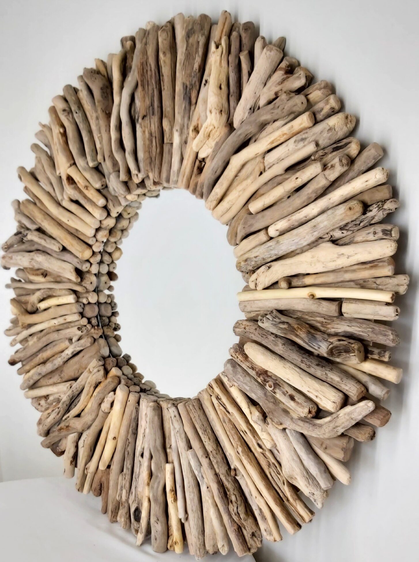 This driftwood mirror titled Summer Sun uses a mixture of coloured woods