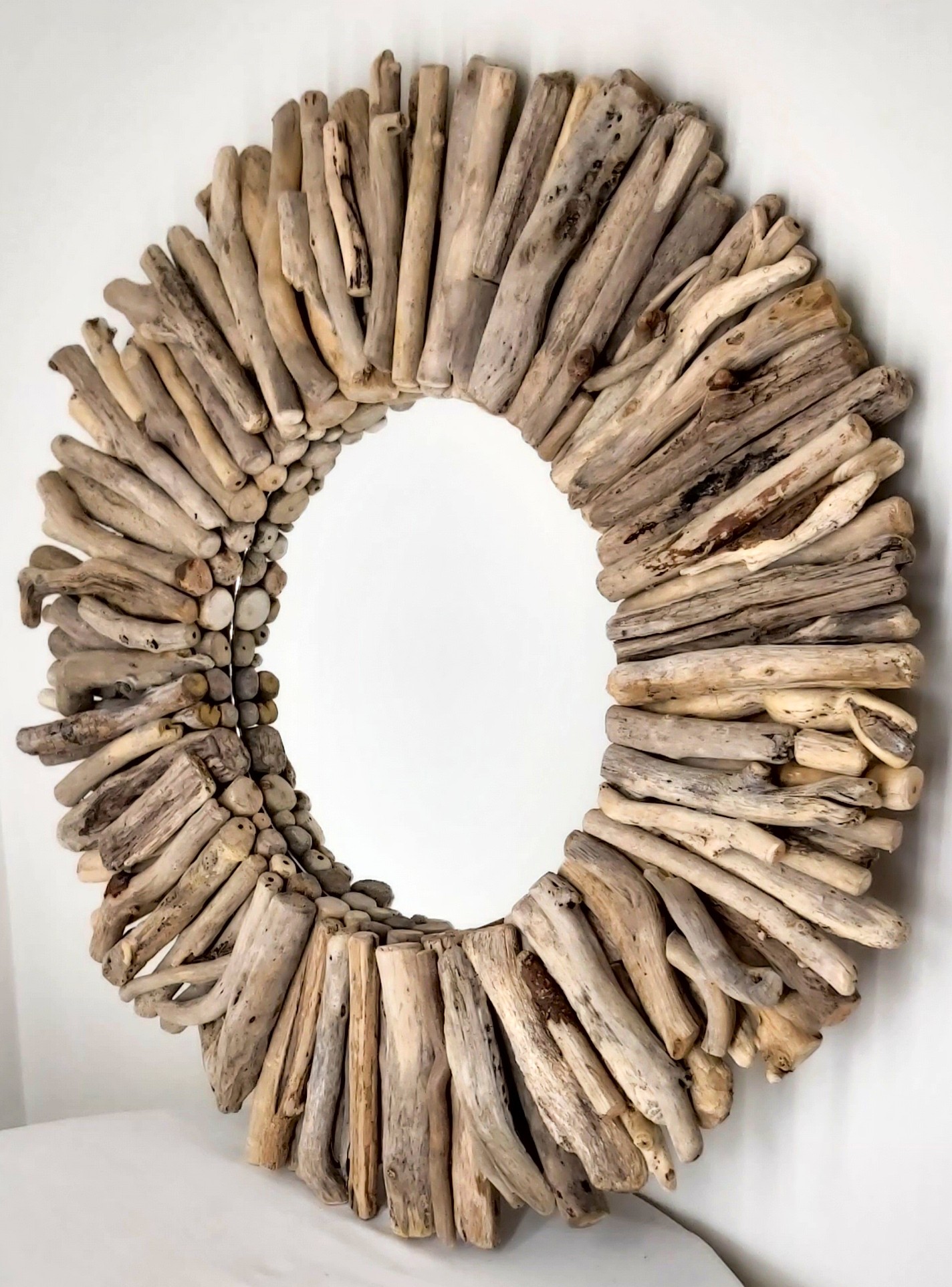 This driftwood mirror titled Warm Sands Seas uses a mixture of warm, gold colours