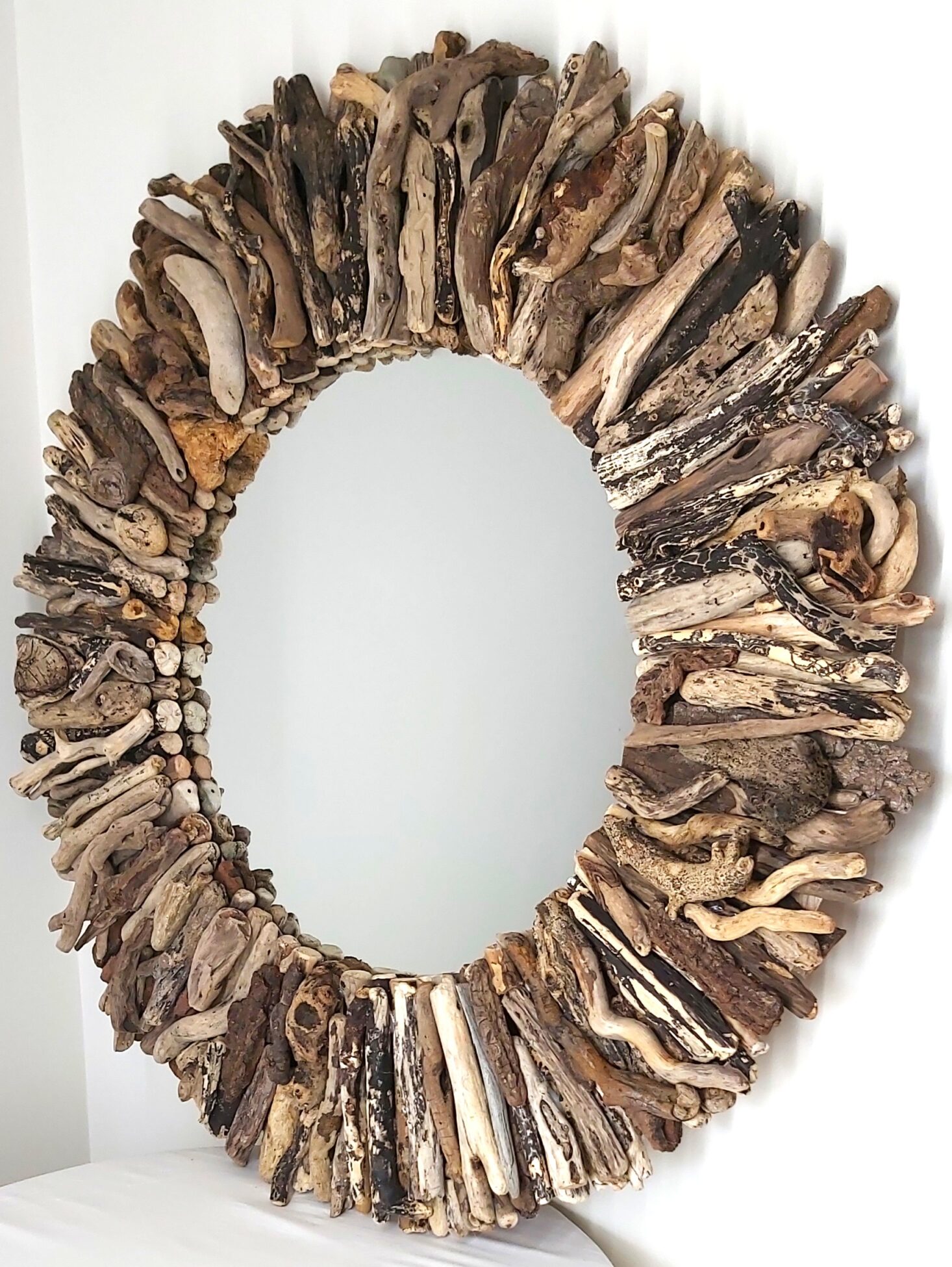 This driftwood mirror titled Winter Storm uses a mixture of coloured wood